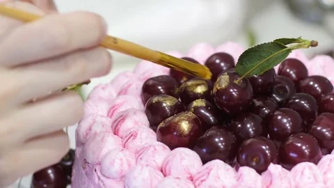Cooking a cake for a holiday. Bake cake for the birthday. The cook prepares Stock Footage 73716242