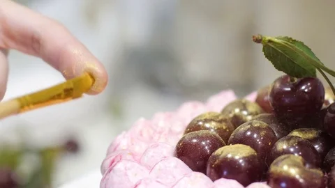 Cooking a cake for a holiday. Bake cake for the birthday. The cook prepares Stock Footage 73717013
