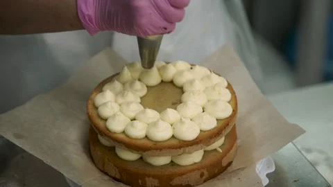 Cooking. Cake Making Business. The Cook Decorates the Cakes with Cream.Handmade Stock Footage 145421745