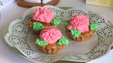 Cooking cake. Ready-made cakes are on plates. Decorated with mint leaves. Stock Footage 104987421
