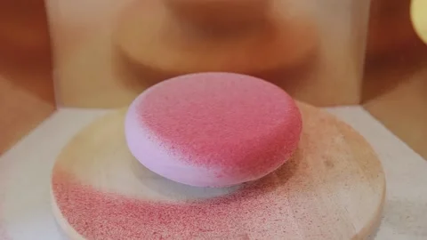 Cooking cake with velour coating. The confectioner spraying velour coating on Stock Footage 134681348