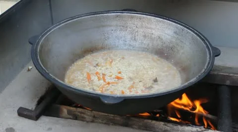 Cooking at caldron  4065 Stock Footage 11315726