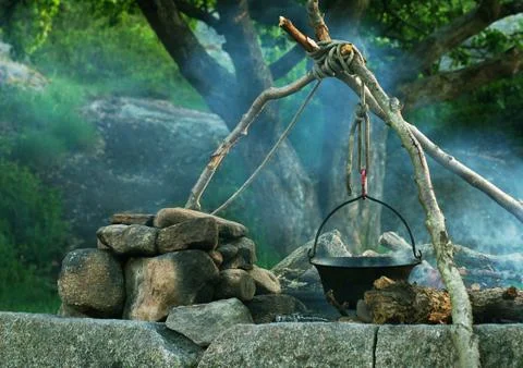 Cooking in caldron Stock Photos
