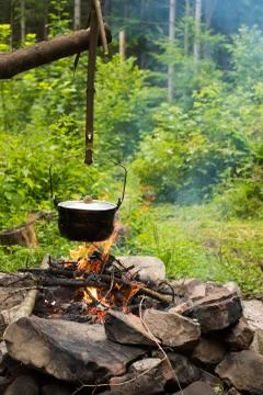 Cooking in caldron Stock Photos