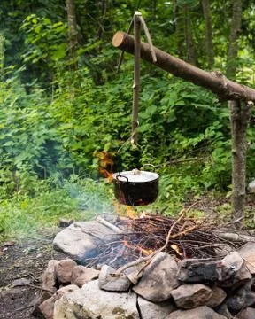 Cooking in caldron Stock Photos