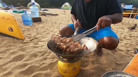 Cooking on a Camp Stove Stock-Footage 124568908