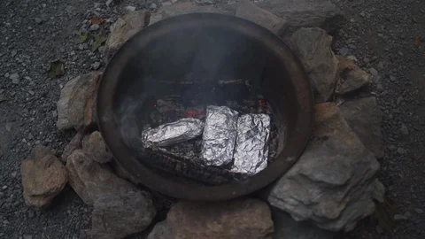 Cooking in a campfire Stock Footage 115353504