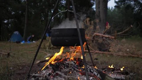 Cooking on a campfire in the forest Stock Photos