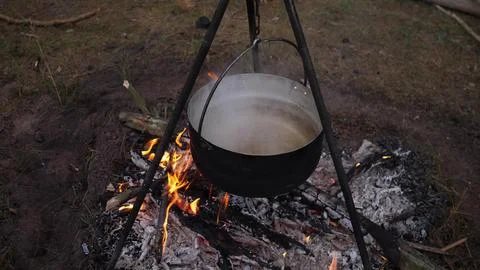 Cooking on a campfire in the forest Stock Photos