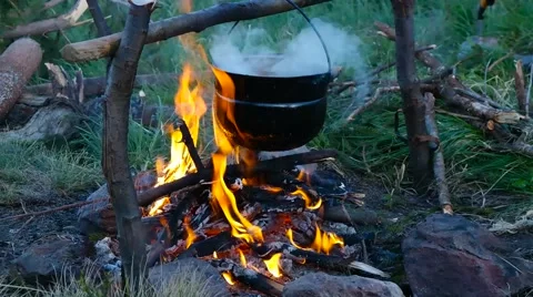 Cooking on a campfire in the mountains Stock Footage 59729122