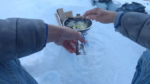 Cooking on a camping site in the snow Stock Footage 152586118