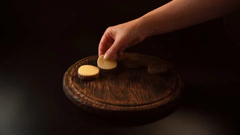 Cooking canapes, bread, cheese, put cheese on slices of bread Video stock 148626733