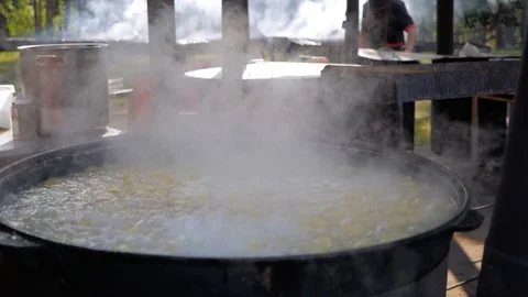 Cooking in a cauldron Stock Footage 94156343