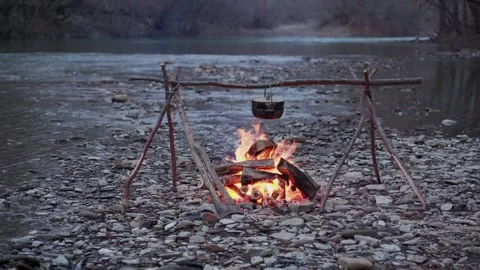 Cooking Cauldron Hanging Over A Fire, Orange Flames In White Smoke #6 Video stock 263150894
