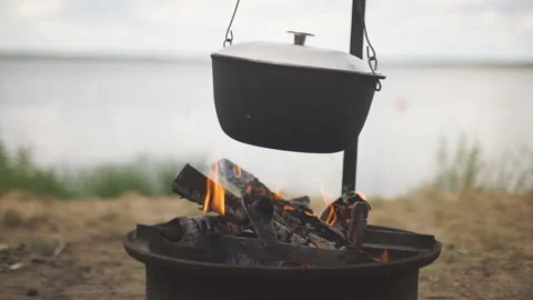 Cooking in the cauldron on the open fire. Stock-Footage 92450223