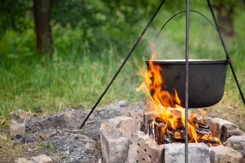 Cooking in a cauldron at the stake Stock Photos