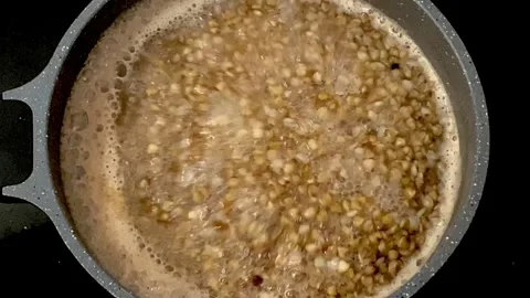 Cooking cereals in a saucepan. A simple and healthy cooking method Stock Footage 319953053