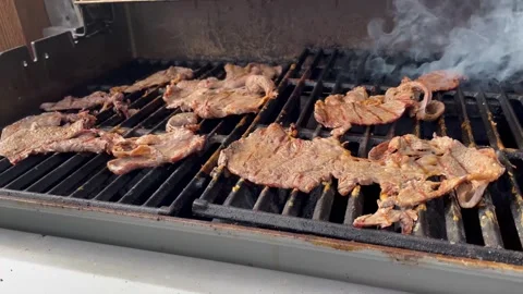 Cooking charcoal-grilled steak Stock Footage 250357093