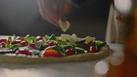 Cooking, Chef chef Baker Deeply involved Adds mozzarella cheese to the baker Stock Footage 242998937