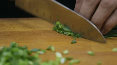 Cooking. Chef is cutting greens in the kitchen Stock Footage 92113564