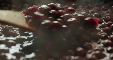 Cooking cherry jam. Cooking jam. Cooking cherry jam in the pelvis with a kitc Stock Footage 146447673