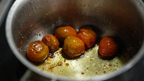 Cooking cherry in a pan in slow motion Stock Footage 339959661