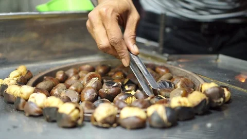 Cooking chestnuts on the fire Stock Footage 92853886