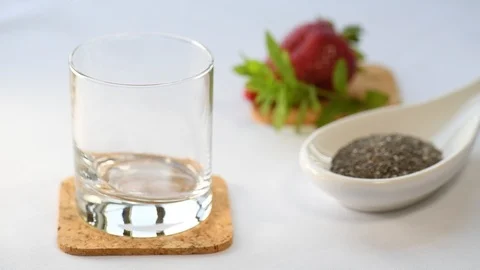 Cooking Chia Pudding: Putting Chia Seeds in a Glass Stock Footage 111428407