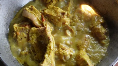 Cooking chicken curry Stock Footage 332576085