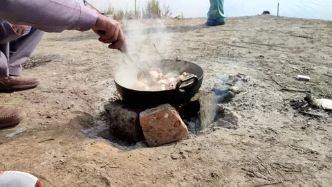 Cooking chicken with old method 動画素材 166804929