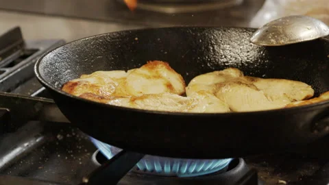 Cooking chicken in pan Stock Footage 233687942
