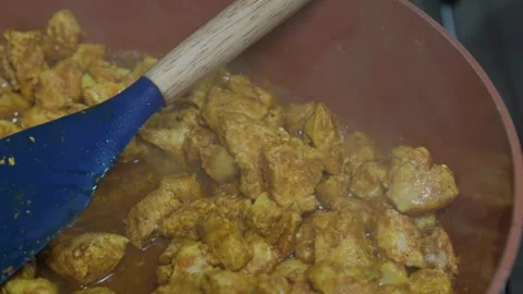 Cooking chicken in a pot Stock Footage 321930445