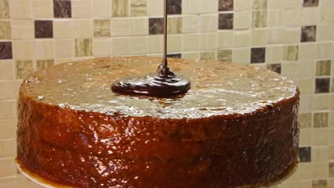 Cooking chocolate cake. Cake made of chocolate biscuit soaked in apricot jam Stock Footage 170999524