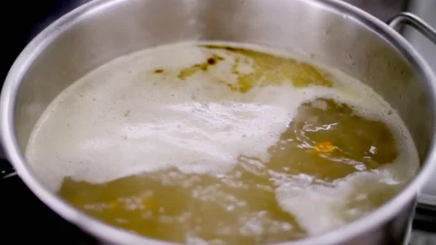 Cooking. close-up. broth is boiling in a saucepan, steam is coming. health food Stock-Footage 138024313