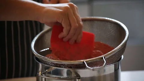 Cooking close up strain pot Stock Footage 77581920
