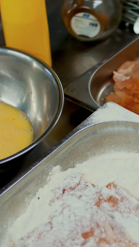 Cooking. close-up. on the table are blanks, raw chicken chops, flour, beaten raw Stock Footage 322713719