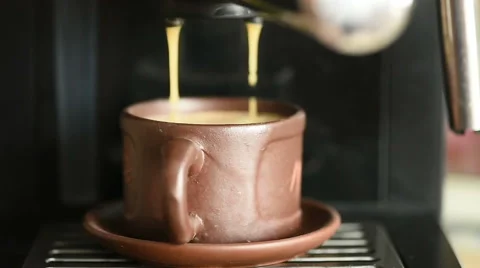 Cooking coffee from coffee machine closeup Stock Footage 63086130