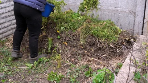 Cooking compost in the backyard. Stock Footage 129810100