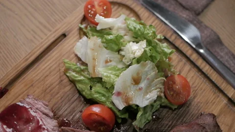 Cooking concept. Grilled marinated beef flank steak on wooden board Stock-Footage 108786524