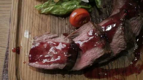 Cooking concept. Grilled marinated beef flank steak on wooden board Stock Footage 108787980