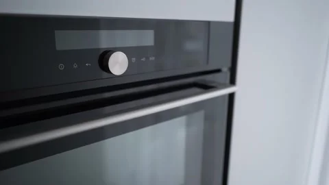 Cooking concept. Kitchen stove handle with modern stylish design. Metal grey Stock Footage 161890318