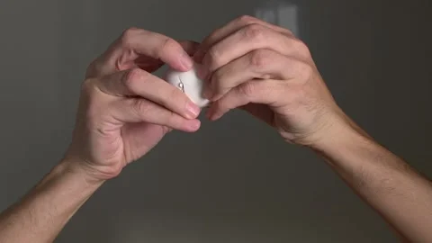 Cooking. Cooking breakfast. Cracking egg. The egg breaks into the camera lens.  Stock Footage 144804964