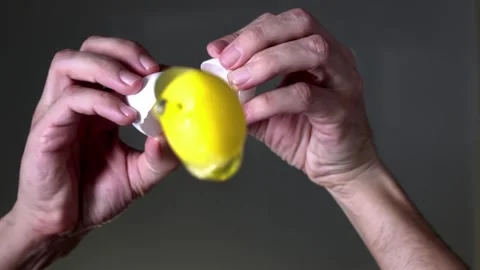 Cooking. Cooking breakfast. Cracking egg. The egg breaks into the camera lens. Stock Footage 144804976