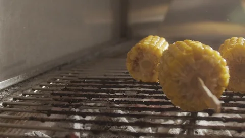 Cooking corn on the grill. Charcoal fried corn. Slow motion video Stock Footage 123788018
