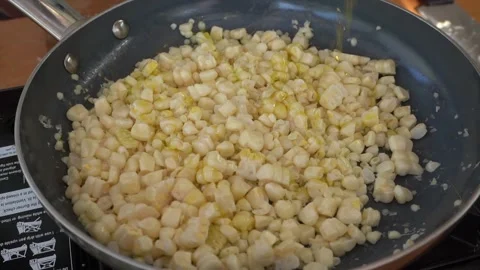Cooking corn with oil Stock Footage 209172669