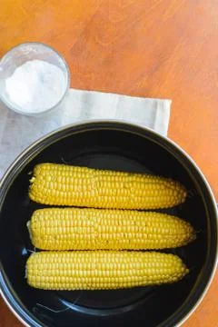 Cooking corn in a pan in the kitchen Foto stock