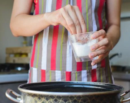 Cooking corn in a pan in the kitchen Stock Photos