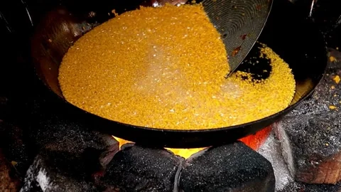 Cooking Cornmeal in a Large Pan over an Open Fire Stock-Footage 308341492