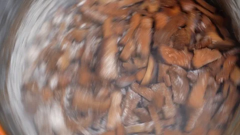 Cooking crackers. Mixing in a centrifuge crackers with garlic (taste). Stock Footage 129532905