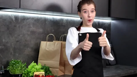 Cooking creativity shines as young chef prepares fresh ingredients in kitchen Stock Footage 296318605